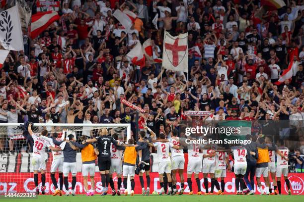 Players of Sevilla FC celebrate with fans following the LaLiga Santander match between Sevilla FC and Villarreal CF at Estadio Ramon Sanchez Pizjuan...