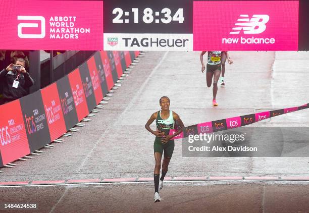 Sifan Hassan of Netherlands celebrates while crossing the finish line to win the Elite Woman's Marathon during the 2023 TCS London Marathon on April...