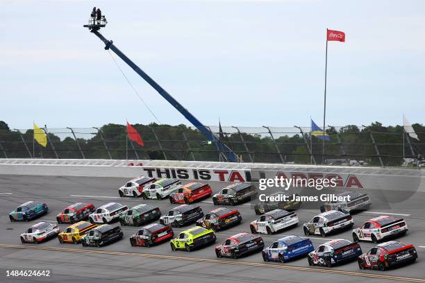 Bubba Wallace, driver of the Columbia Sportswear Company Toyota, and Denny Hamlin, driver of the FedEx Freight Direct Toyota, lead the fieldduring...