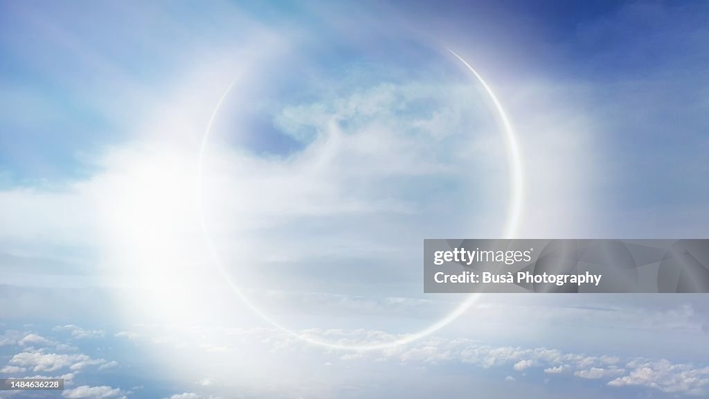 Light effect similar to an eclypse above clouds in the sky (manipulated image)
