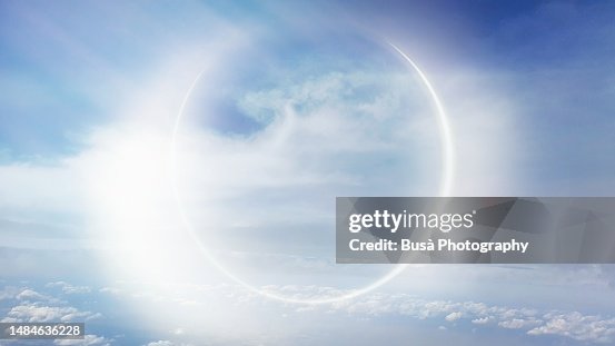 Light effect similar to an eclypse above clouds in the sky (manipulated image) Light effect similar to an eclypse above clouds in the sky (manipulated image)