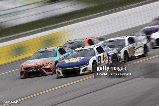 Chase Elliott, driver of the NAPA Auto Parts Chevrolet, and Bubba Wallace, driver of the Columbia Sportswear Company Toyota, lead the field during...