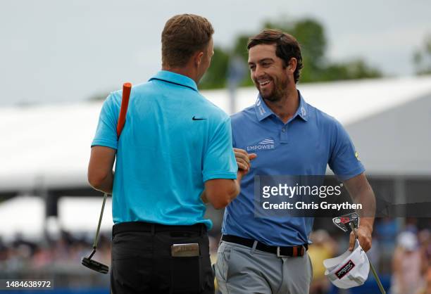 Nick Hardy of the United States and Davis Riley of the United States react on the 18th green during the final round of the Zurich Classic of New...