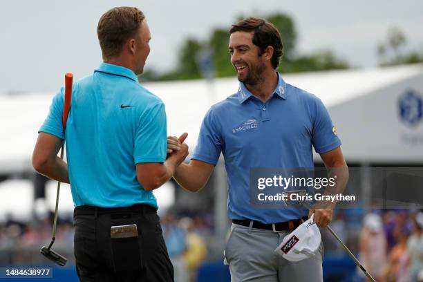 Nick Hardy of the United States and Davis Riley of the United States react on the 18th green during the final round of the Zurich Classic of New...