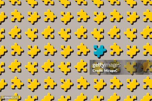 a different piece in jigsaw puzzle - ausstoßen stock-fotos und bilder