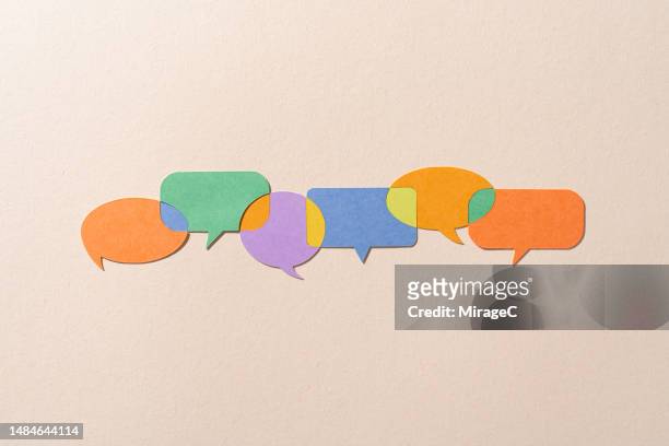 speech bubbles connected with common grounds, paper craft - exchanging information stock pictures, royalty-free photos & images