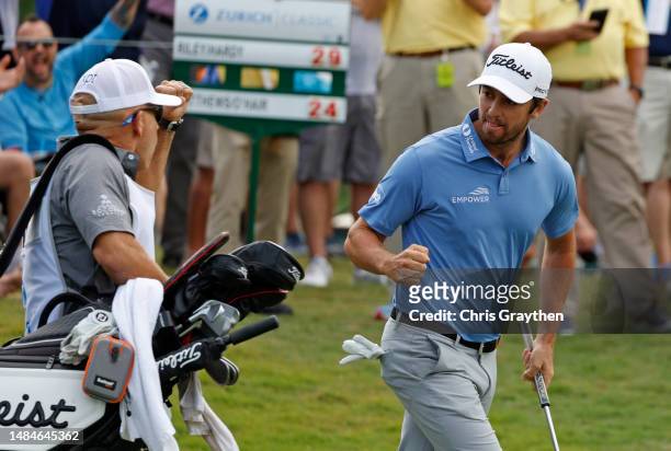 Davis Riley of the United States reacts to a birdie putt on the 17th green during the final round of the Zurich Classic of New Orleans at TPC...