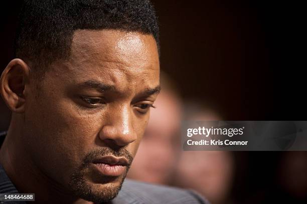 Will Smith listens as his wife Jada Pinkett Smith speaks during the "The Next Ten Years In The Fight Against Human Trafficking: Attacking The Problem...