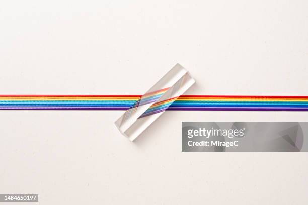 triangle prism refracting rainbow color of ropes - cross channel stock pictures, royalty-free photos & images
