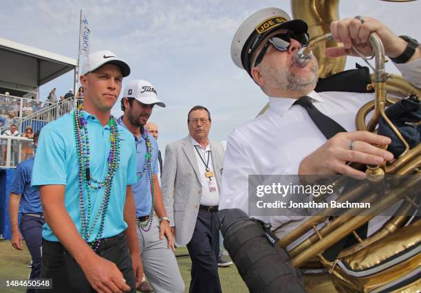 Nick Hardy of the United States and Davis Riley of the United States celebrate their win as they make their way to the 18th green for the trophy...