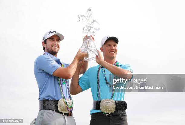 Davis Riley of the United States and Nick Hardy of the United States pose with the trophy and commemorative belts after their win during the final...