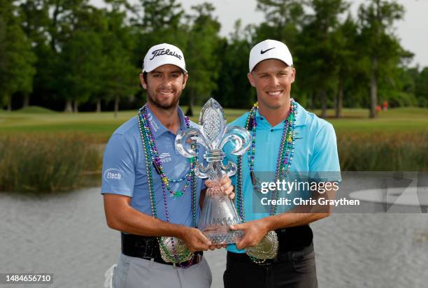 Davis Riley of the United States and Nick Hardy of the United States pose with the trophy and commemorative belts after their win during the final...