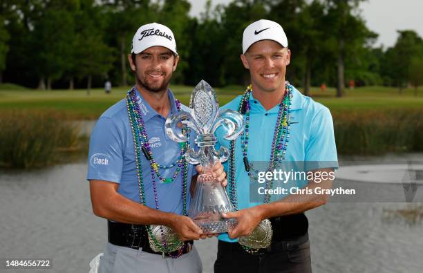 Davis Riley of the United States and Nick Hardy of the United States pose with the trophy and commemorative belts after their win during the final...