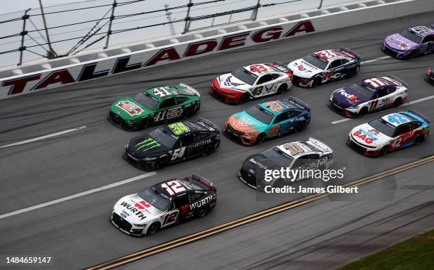 Ryan Blaney, driver of the Wurth Ford, Ty Gibbs , driver of the Monster Energy Toyota, and Ryan Preece, driver of the Hunt Brothers Pizza Ford, lead...