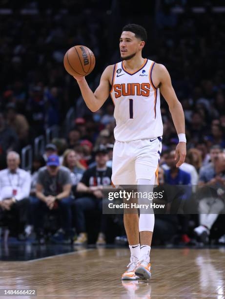 Devin Booker of the Phoenix Suns brings the ball up court during a 112-100 win over the LA Clippers in Game Four of the Western Conference First...