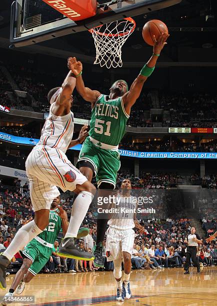 Keyon Dooling of the Boston Celtics drives to the basket against the Charlotte Bobcats during the game at the Time Warner Cable Arena on April 15,...