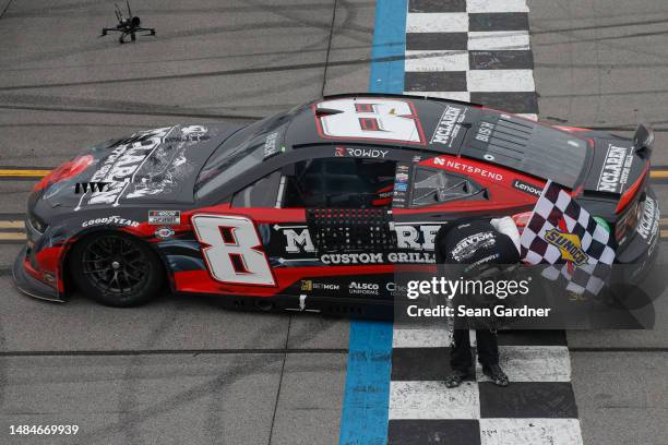 Kyle Busch, driver of the McLaren Custom Grills Chevrolet, takes a bow after winning the NASCAR Cup Series GEICO 500 at Talladega Superspeedway on...