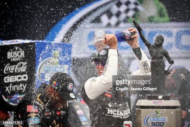 Kyle Busch, driver of the McLaren Custom Grills Chevrolet, celebrates in Victory Lane after winning the NASCAR Cup Series GEICO 500 at Talladega...