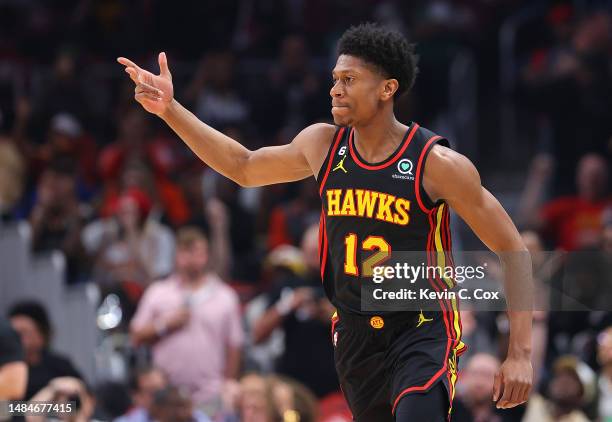 De'Andre Hunter of the Atlanta Hawks reacts after hitting a three-point basket against the Boston Celtics during the first quarter of Game Four of...