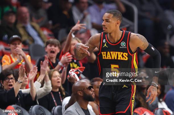 Dejounte Murray of the Atlanta Hawks reacts after hitting a three-point basket against the Boston Celtics during the first quarter of Game Four of...
