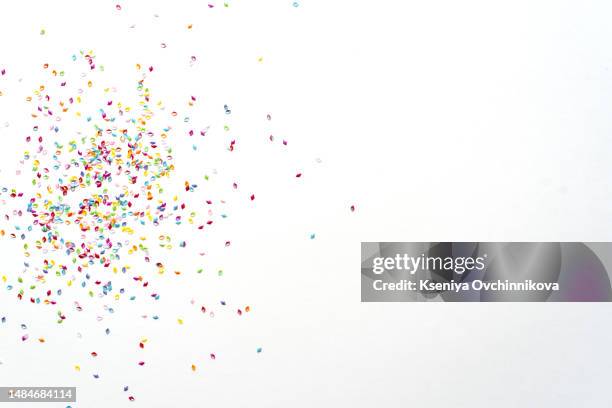 colorful confetti in front of white background - coriandolo foto e immagini stock