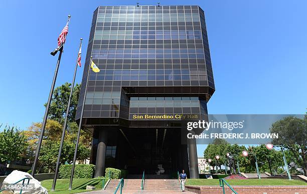 Woman makes her way out of the San Bernadino City Hall building on July 17, 2012 in San Bernardino, California. The city in what is known as southern...