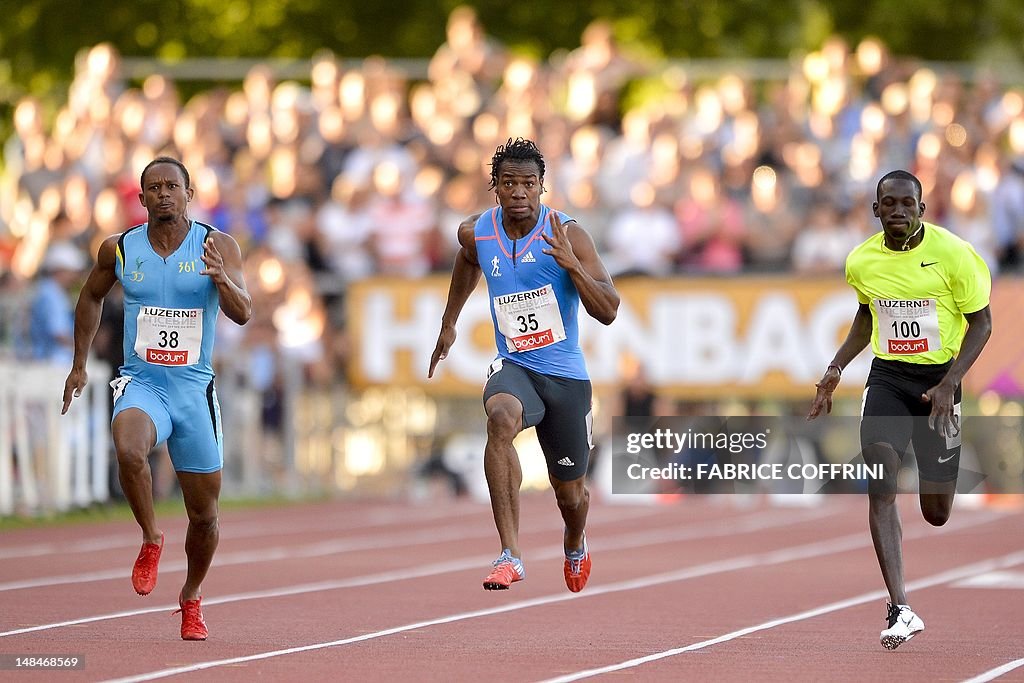 Jamaican sprinter Yohan Blake (C) runs b