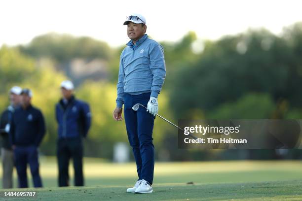 Charlie Wi of South Korea reacts after hitting a shot on the 18th hole during the final round of the Invited Celebrity Classic at Las Colinas Country...