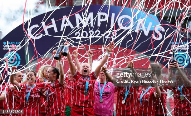 Players of Bristol City celebrate as Fran Bentley lifts the Women's Championship Trophy after securing promotion to the Women's Super League after...