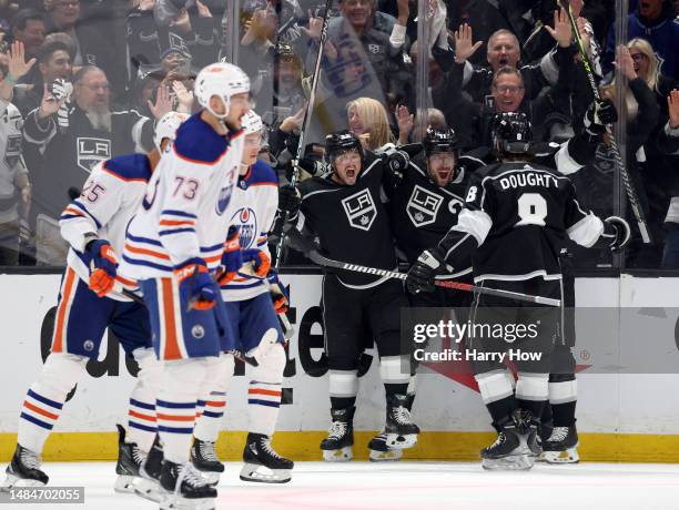 Anze Kopitar of the Los Angeles Kings celebrates his goal with Kevin Fiala and Drew Doughty, to take a 3-0 lead over the Edmonton Oilers during the...