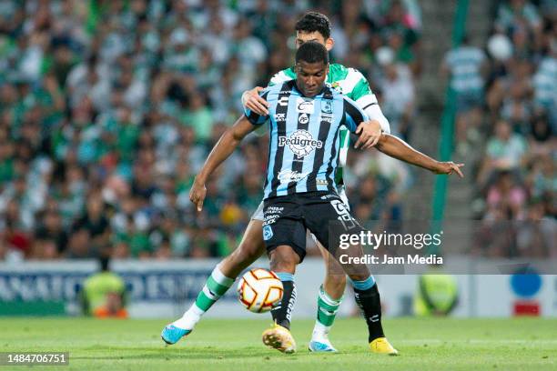 Jose Zuniga of Queretaro fights for the ball during the 16th round match between Santos Laguna and Queretaro as part of the Torneo Clausura 2023 Liga...