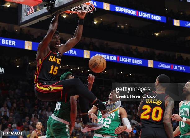 Clint Capela of the Atlanta Hawks dunks against Marcus Smart of the Boston Celtics during the fourth quarter of Game Four of the Eastern Conference...