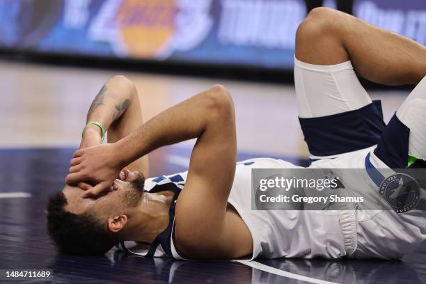 Kyle Anderson of the Minnesota Timberwolves lies on the court after being hit during the third quarter against the Denver Nuggets at Target Center on...