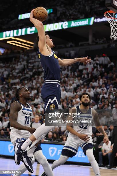 Michael Porter Jr. #1 of the Denver Nuggets drives to the basket against Taurean Prince of the Minnesota Timberwolves during the fourth quarter at...