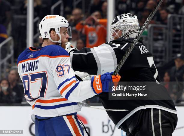 Joonas Korpisalo of the Los Angeles Kings pushes Connor McDavid of the Edmonton Oilers form the goal during the third period in Game Four of the...
