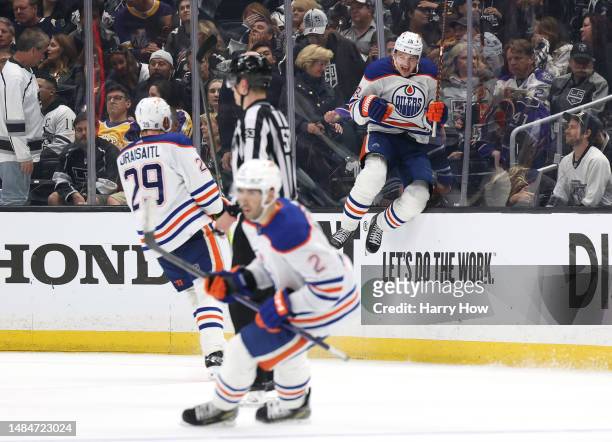 Zach Hyman of the Edmonton Oilers celebrates his goal with Leon Draisaitl and Evan Bouchard, for a 5-4 win over the Los Angeles Kings, during...