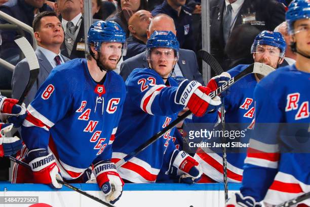 Jacob Trouba and Adam Fox of the New York Rangers argue a call from the bench against the New Jersey Devils in Game Three of the First Round of the...