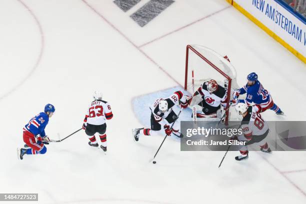 Akira Schmid of the New Jersey Devils tends the net against the New York Rangers in Game Three of the First Round of the 2023 Stanley Cup Playoffs at...