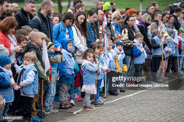 Children wait for the ceremony of joining the organization during the ceremony celebrating the 111th anniversary of Plast on April 22, 2023 in Lviv,...