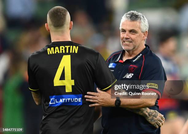 Dustin Martin of the Tigers hugs Mark Williams the assistant coach of the Demons during the round six AFL match between Melbourne Demons and Richmond...