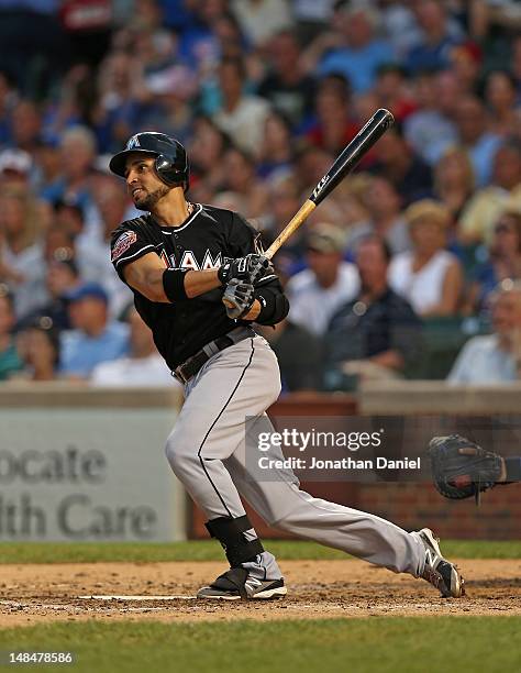 Omar Infante of the Miami Marlins hits a two-run home run in the 4th inning against the Chicago Cubs at Wrigley Field on July 17, 2012 in Chicago,...