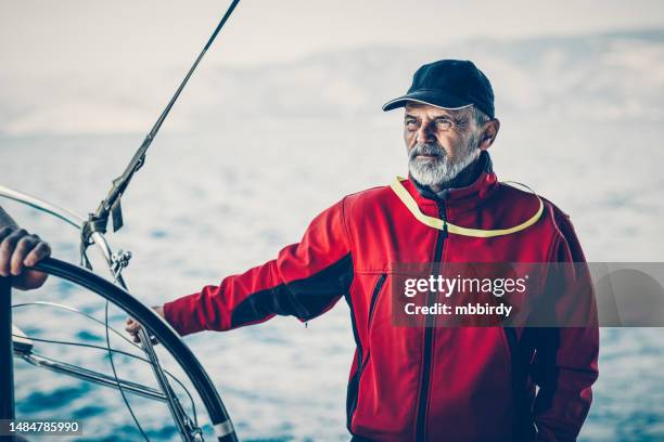 skipper resting on sailboat during sailing - captain yacht stock pictures, royalty-free photos & images