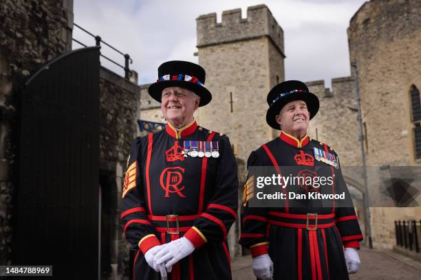 Yeoman Warder, Peter McGowran, and Yeoman Goaler Rob Fuller pose for a portrait wearing their new uniforms featuring King Charles III's new insignia...