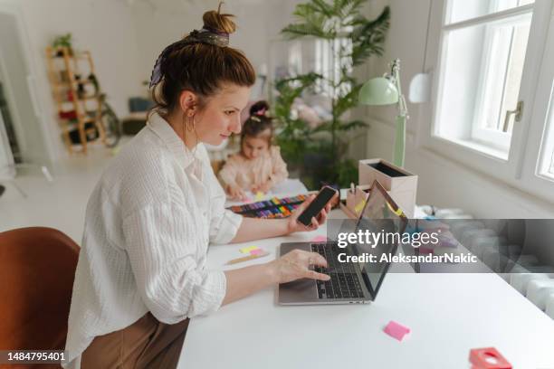 busy morning in our home office - working parents stock pictures, royalty-free photos & images