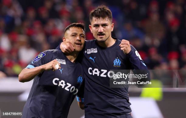 Cengiz Under of Marseille celebrates his goal with Alexis Sanchez during the Ligue 1 Uber Eats match between Olympique Lyonnais and Olympique de...