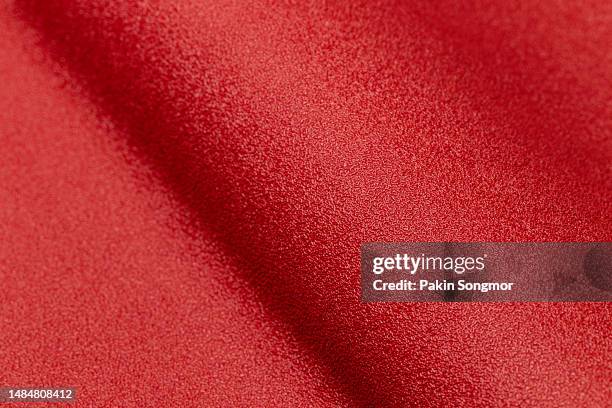 red leather and a textured background. - car interieur stock pictures, royalty-free photos & images