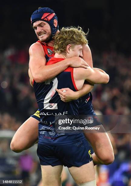 Jacob Van Rooyen of the Demons is congratulated by Angus Brayshaw after kicking a goal during the round six AFL match between Melbourne Demons and...