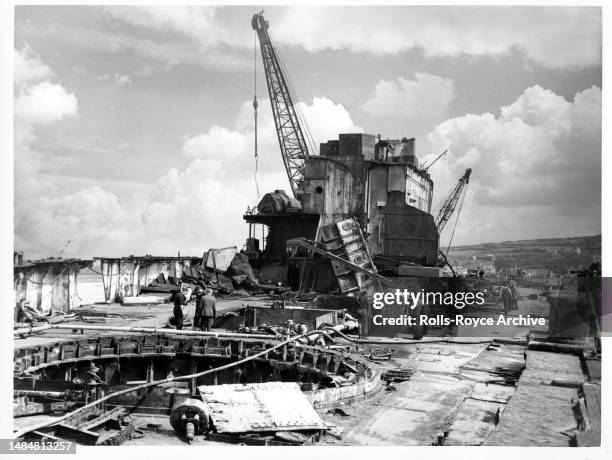 Undated May 1952: Raising the HMS Warspite Battleship May 1952 - Rolls-Royce Derwent V aero engines were used as air pumps to expel sea water from...