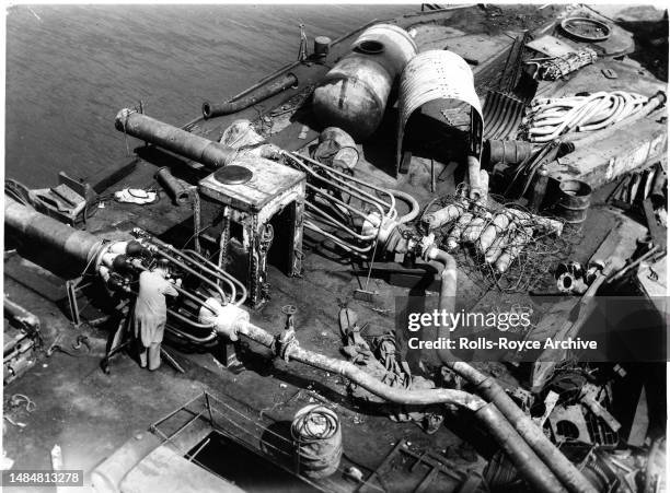 Undated May 1952: Raising the HMS Warspite Battleship May 1952 - Rolls-Royce Derwent V aero engines were used as air pumps to expel sea water from...