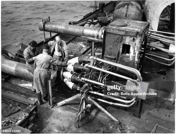 Undated May 1952: Raising the HMS Warspite Battleship May 1952 - Rolls-Royce Derwent V aero engines were used as air pumps to expel sea water from...